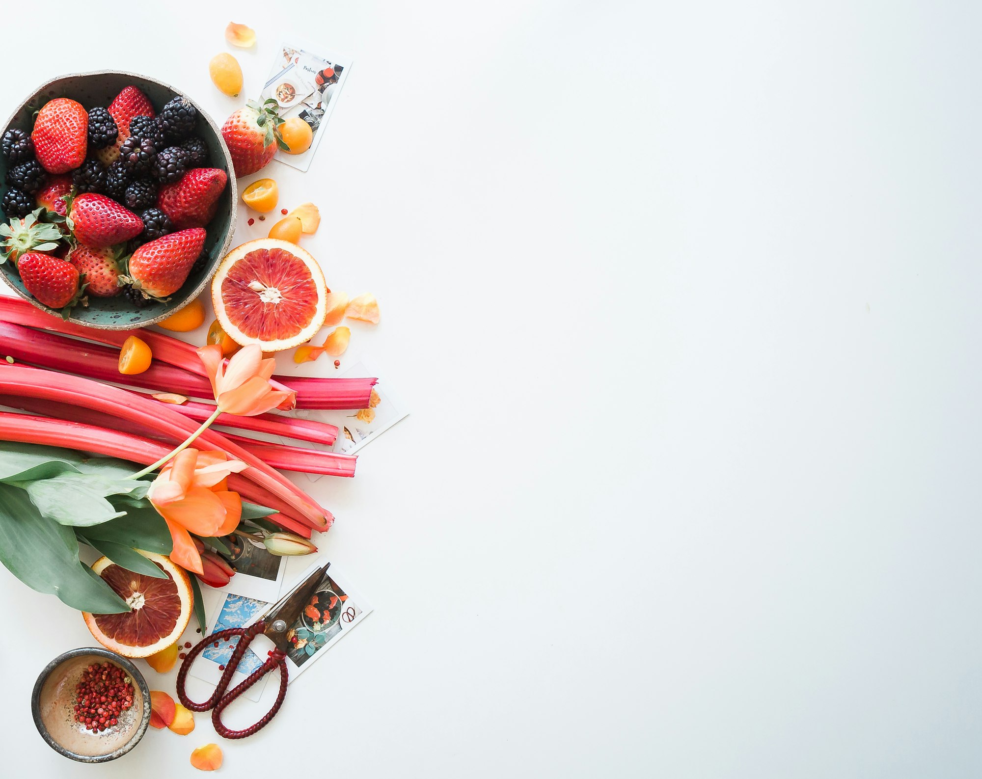 Fresh seasonal produce arranged on a soft neutral surface.